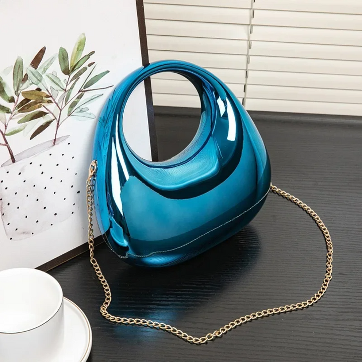 Elegant sculptural acrylic clutch bag, women's evening accessory with gloss.