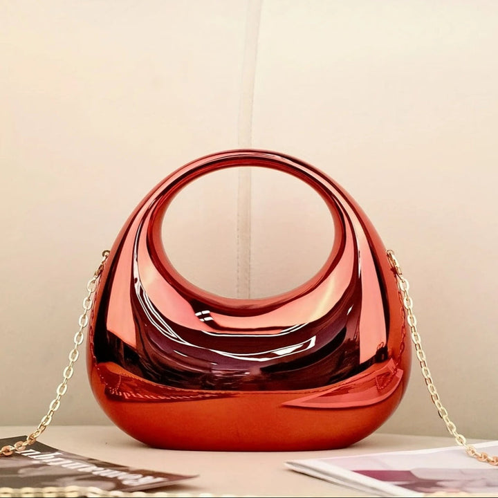 Modern women's sculptural acrylic party clutch, a chic statement bag.