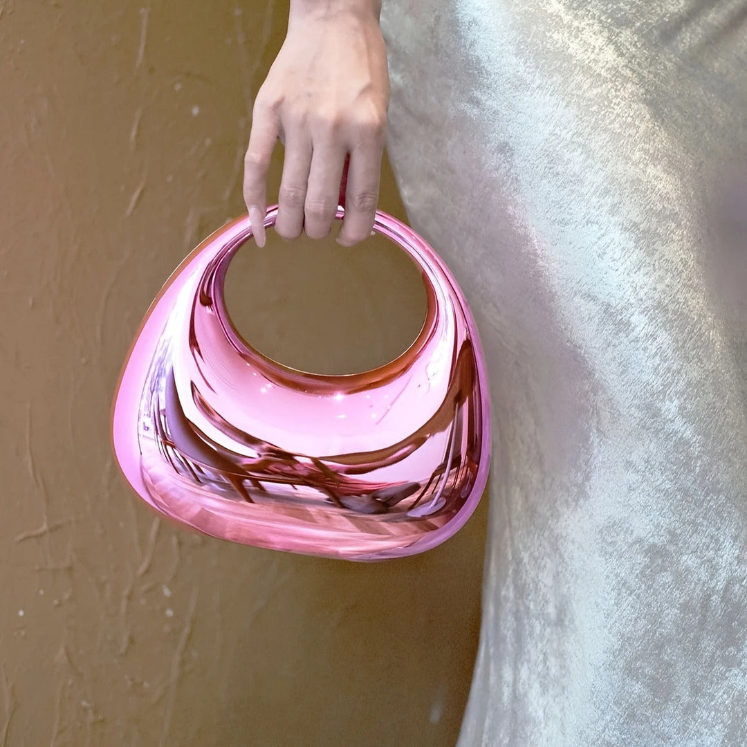Women's glossy acrylic sculptural clutch, perfect for special events.