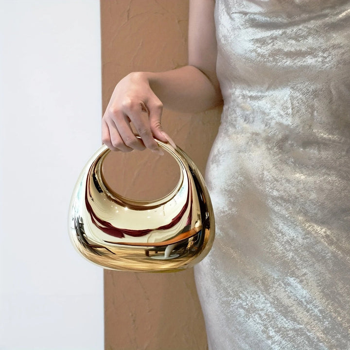 Stylish women's sculptural acrylic clutch, an elegant party statement piece.