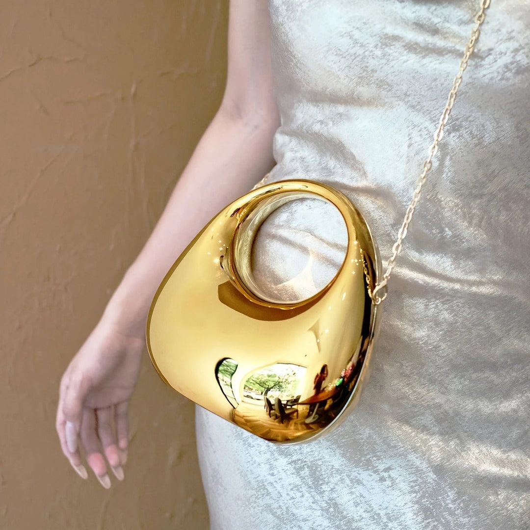 Modern sculptural acrylic clutch bag for women, sleek and glossy finish.