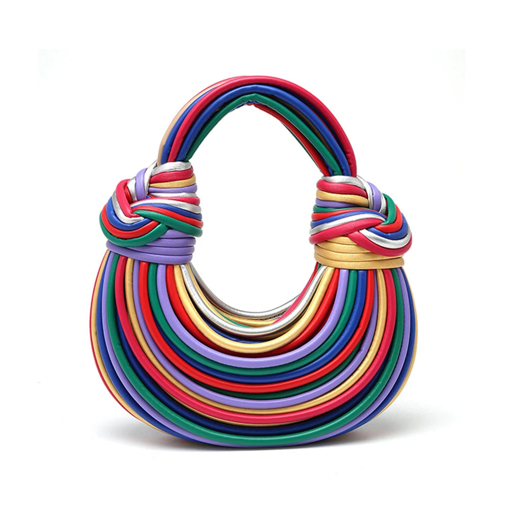 Sculptural vegan leather statement accessory, this women's handbag can be a shoulder or crossbody.