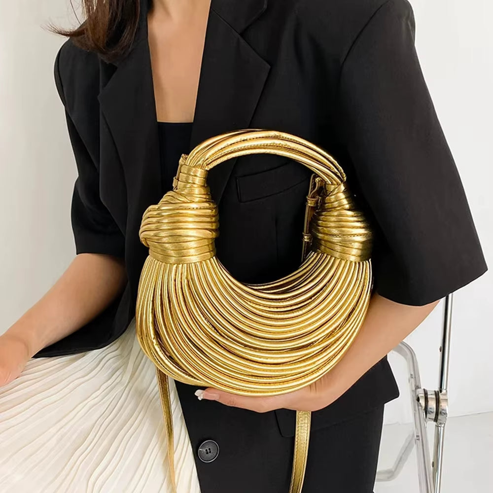 Premium vegan leather sculptural handbag for women, a luxury fashion statement with detachable strap.