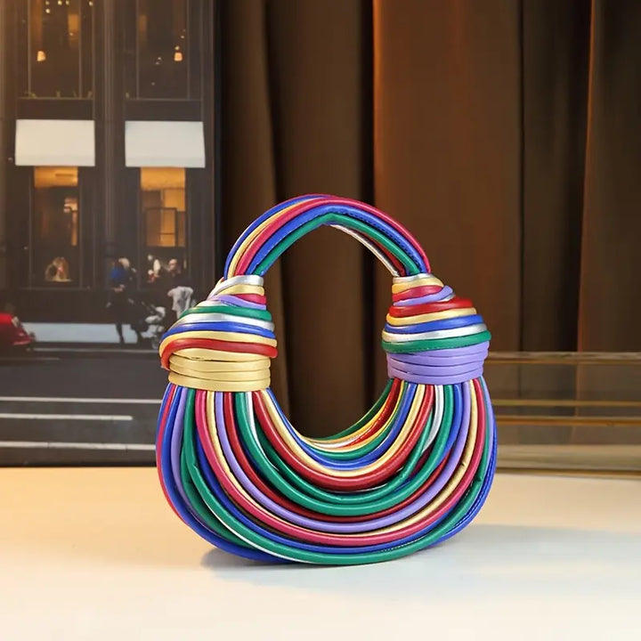 Unique sculptural vegan leather handbag, an eye-catching women's fashion accessory.