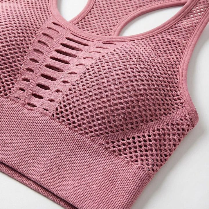 A model wearing a white seamless breathable sports bra, showcasing its comfortable fit and supportive design for running.
