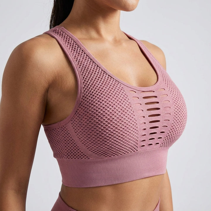 Seamless breathable sports bra in a vibrant pink, designed for women's activewear, providing optimal support and comfort.