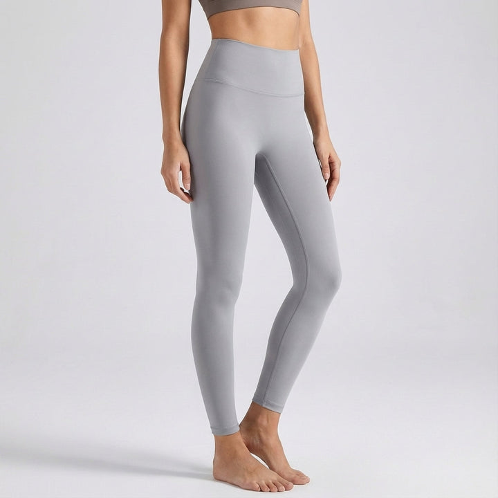Model wearing breathable seamless high-waist yoga pants, perfect for studio or outdoor