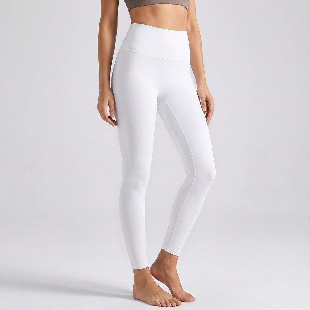 Athletic woman in black seamless high-waist leggings showcasing comfortable fit and style