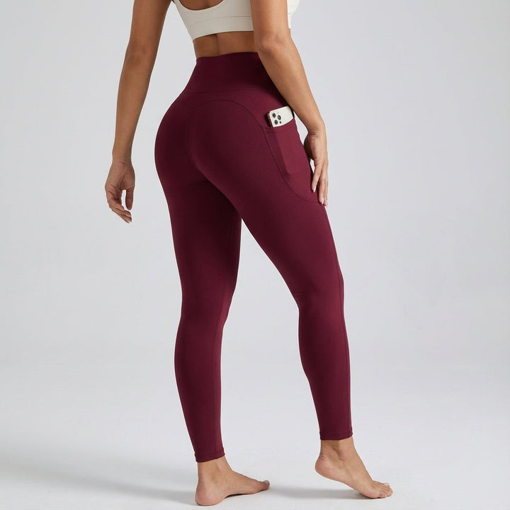 Close-up of seamless high-waisted gray workout leggings with discrete side pocket for phone