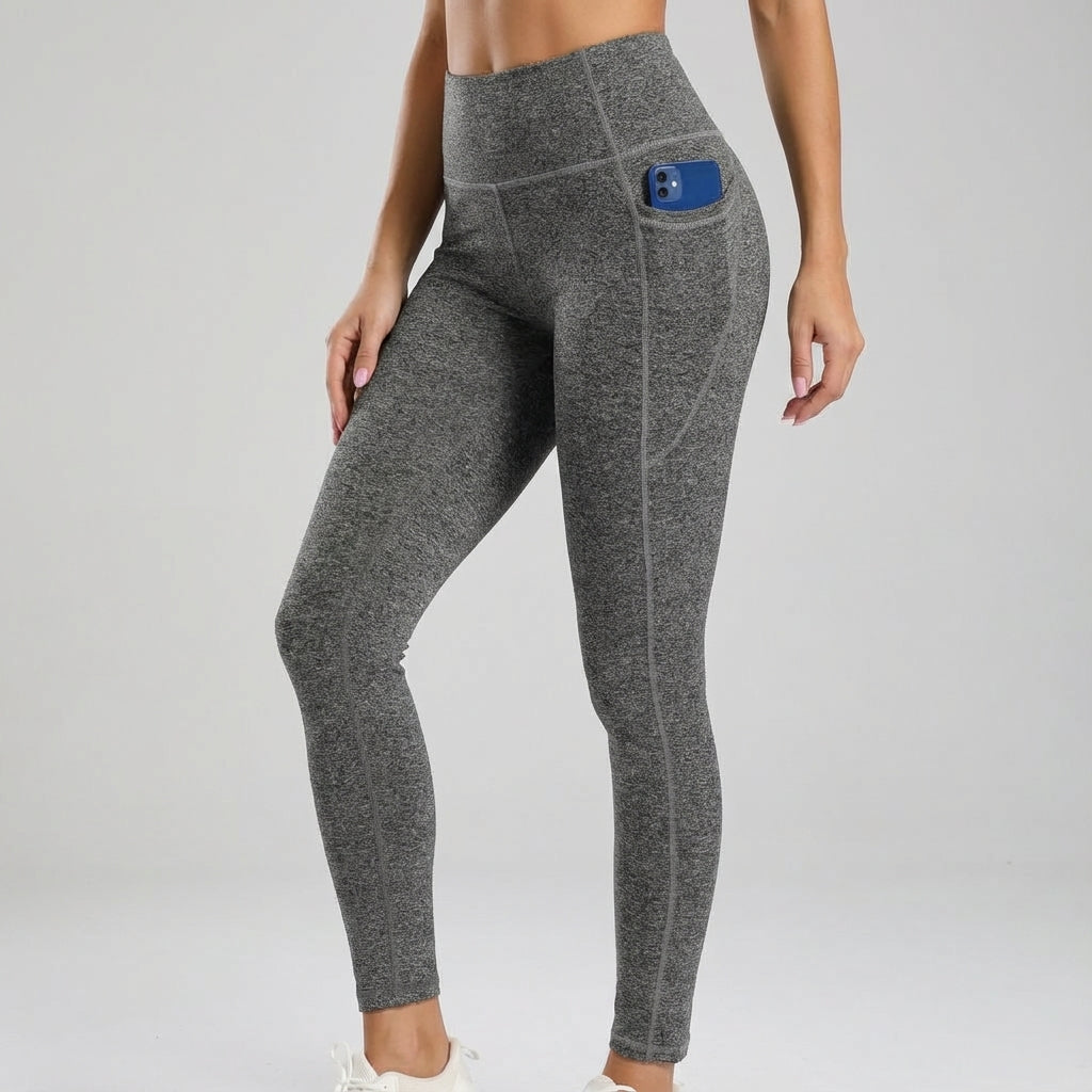Athletic woman posing in blue seamless high-waisted leggings with deep side pockets
