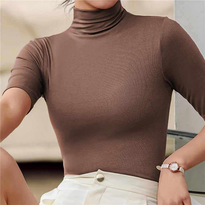 Figure-hugging seamless roll neck top for women. Soft, long sleeve, flattering fit for all body types, including plus size.