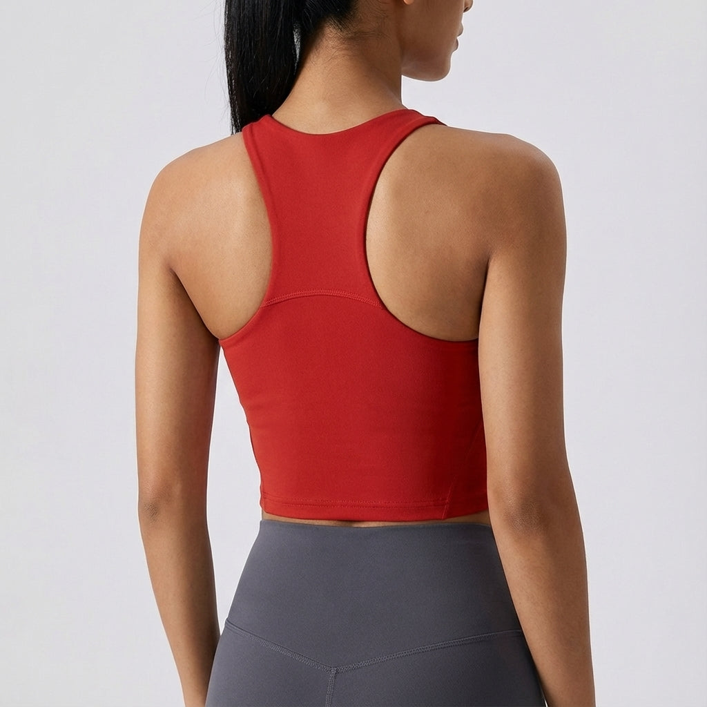 Black seamless crop top for women, featuring removable pads, versatile for gym and activewear.