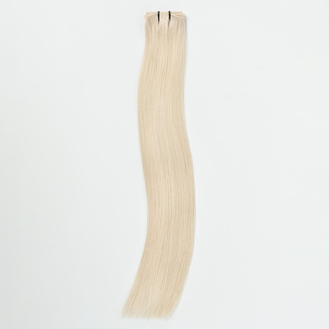 Blonde 60B light ash seamless hair extension strip, invisible for volume & natural-looking length.