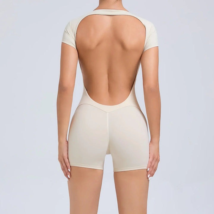 Close-up: Seamless, stretchy fabric of women's yoga jumpsuit, highlighting breathability & comfort.