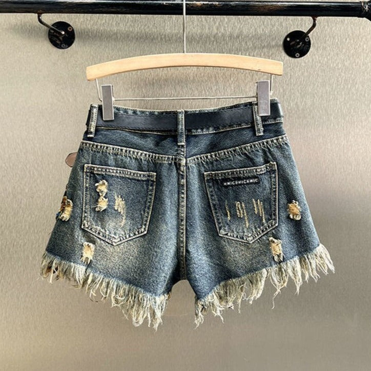 Casual chic women's embellished shorts with vibrant floral sequins, perfect for trendy summer fashion.
