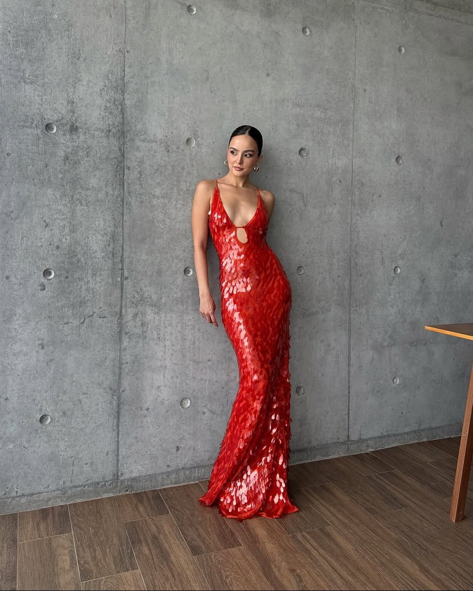 Glamorous women's sequin maxi dress with a flattering plunge neck. An eye-catching choice for any formal event.