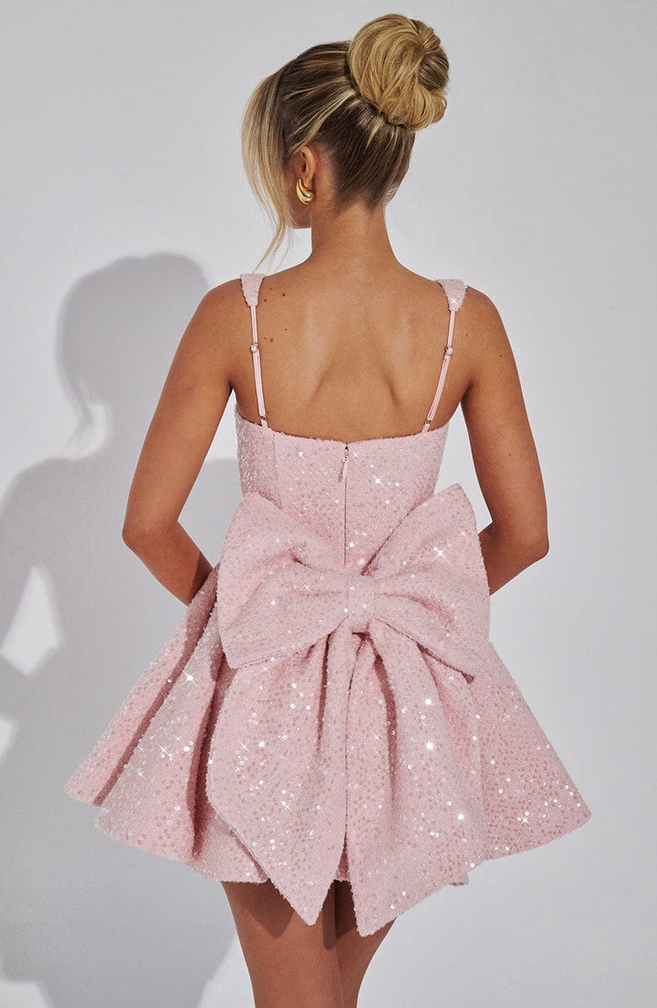 Pink sequin skater homecoming dress for women, featuring a cute bow and flared skirt, perfect for parties.