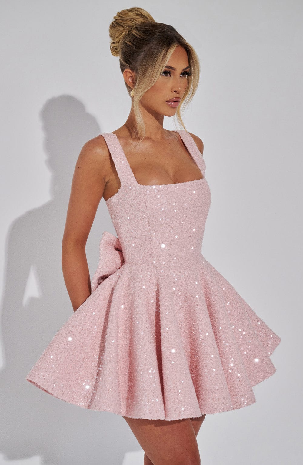 White sequin skater party dress for women with a charming bow, ideal for homecoming or special events.