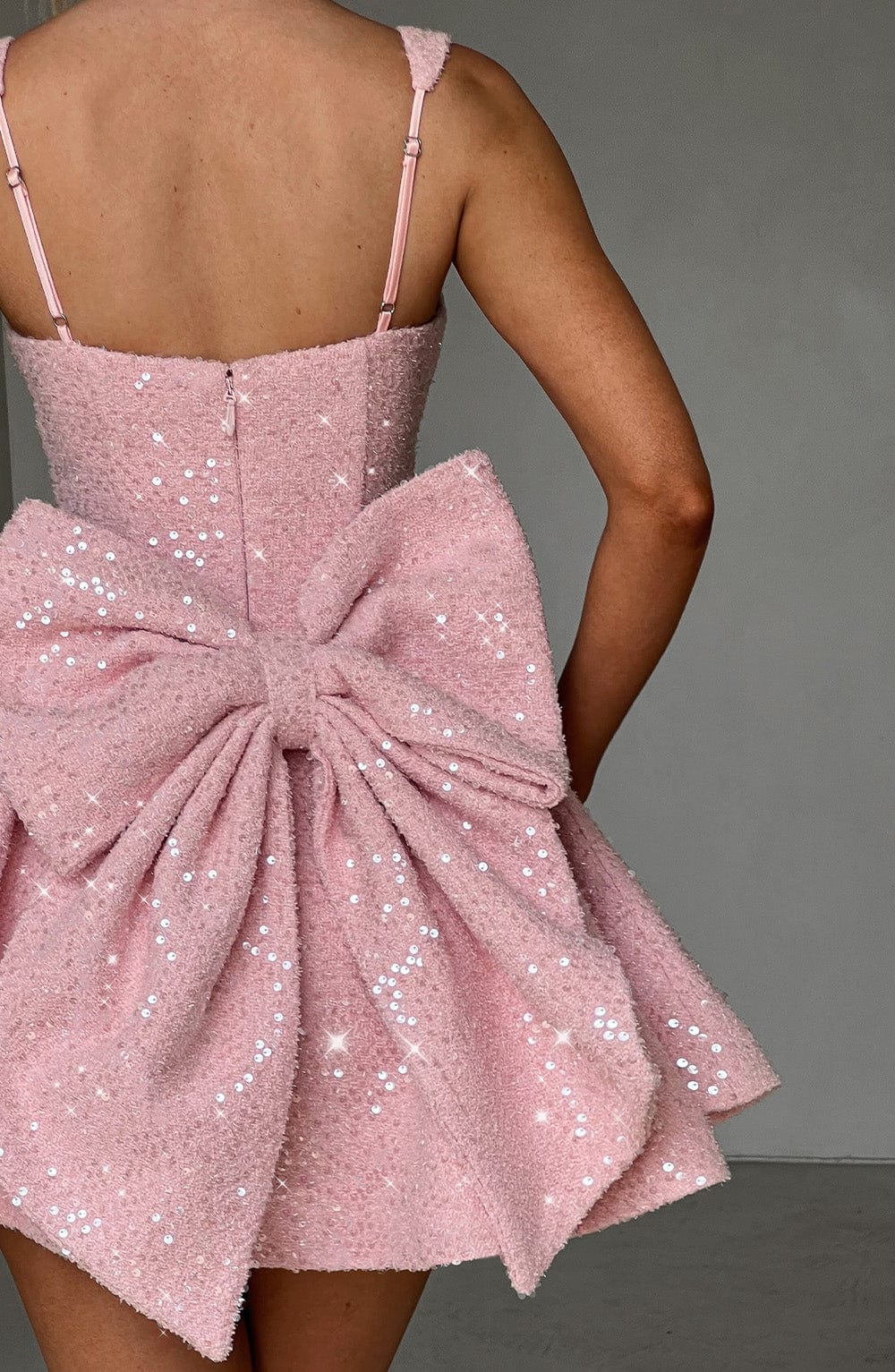 Sparkly women's party dress: sequin skater style with a cute bow, perfect for homecoming or special events.