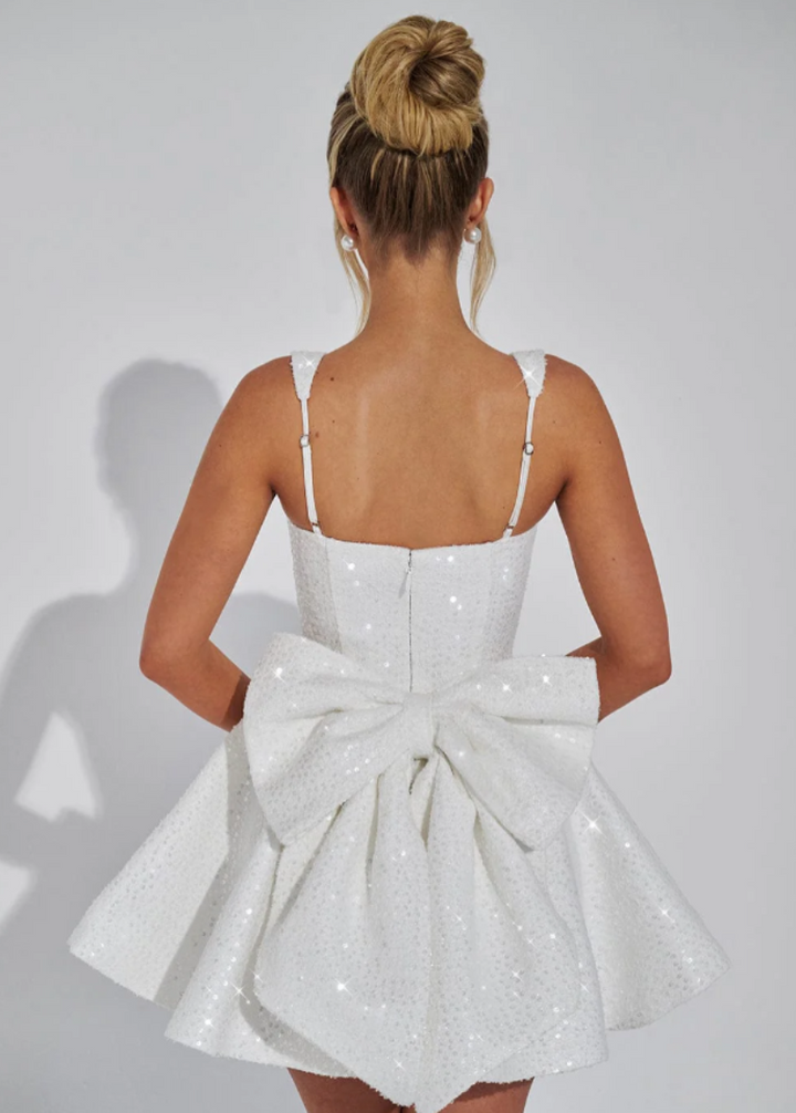 Glamorous sequin skater homecoming dress for women, featuring an elegant bow and dance-ready flare.