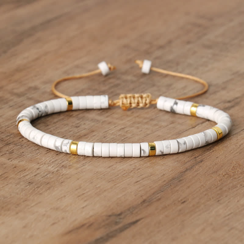 Elegant women's Seraphina bracelet, featuring braided design & natural gemstone rollers.