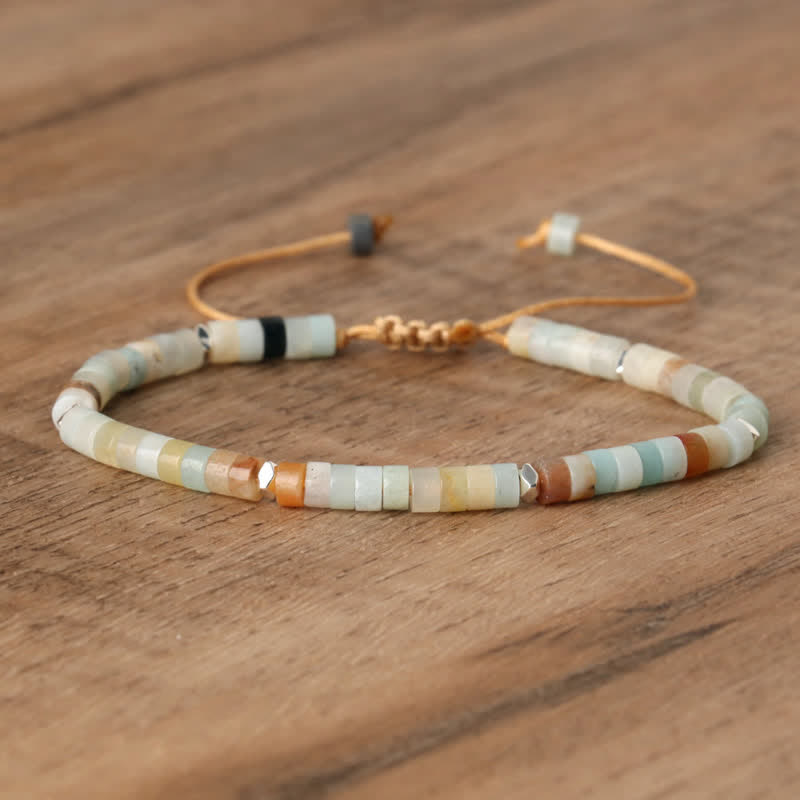 Women's spiritual Seraphina bracelet: braided cord, natural stone rollers for healing energy.