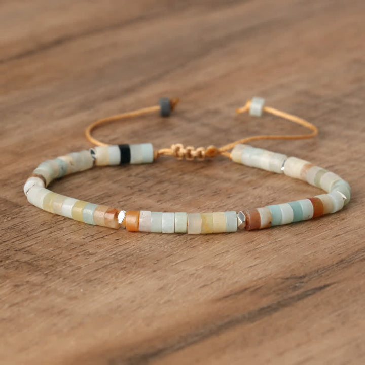 Women's spiritual Seraphina bracelet: braided cord, natural stone rollers for healing energy.