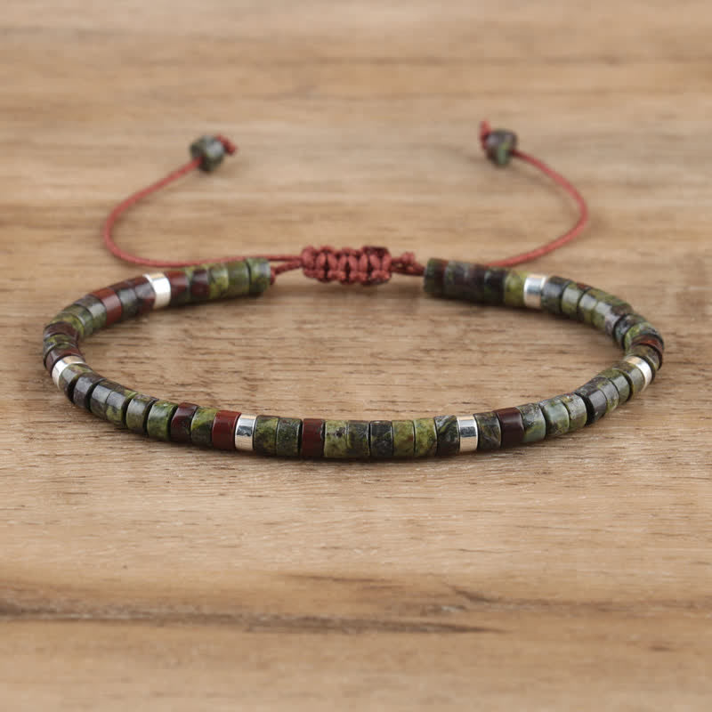Handmade women's Seraphina bracelet, featuring braided band & natural stone rollers.