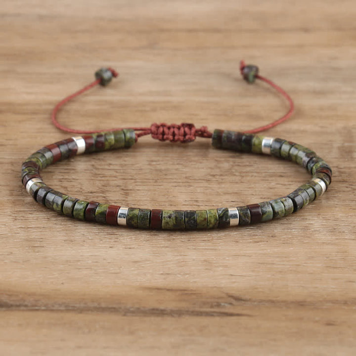 Handmade women's Seraphina bracelet, featuring braided band & natural stone rollers.