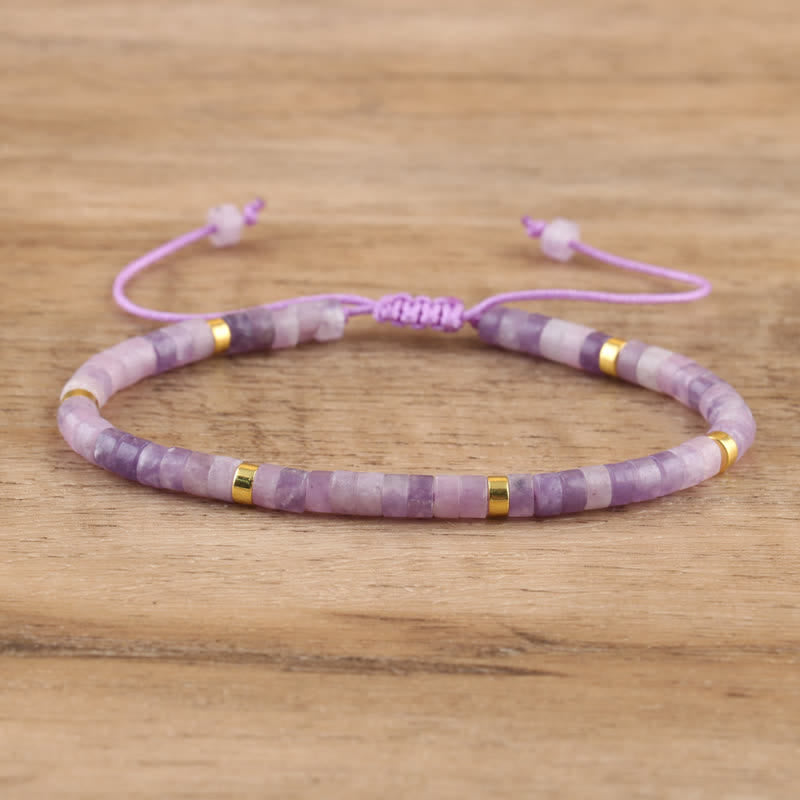 Adjustable Seraphina women's bracelet: braided, with natural stone rollers for a spiritual touch.