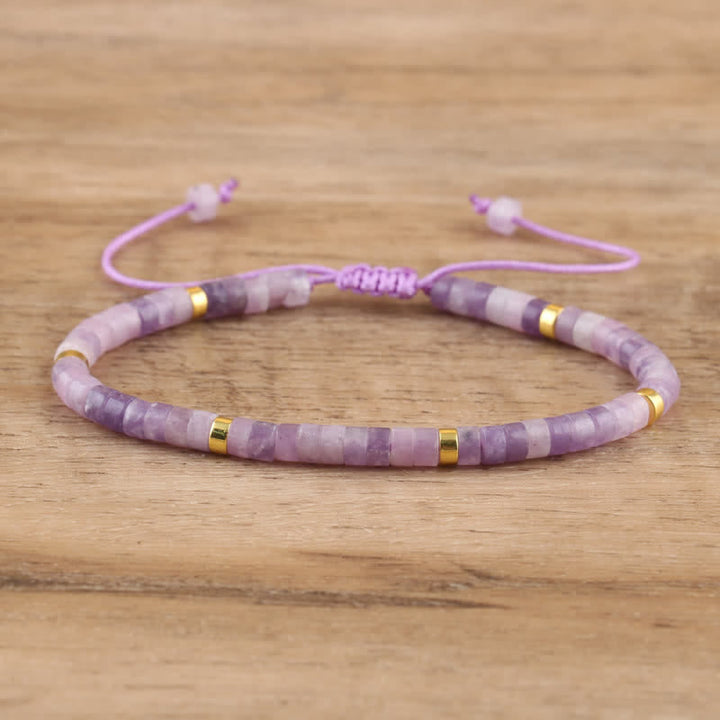 Adjustable Seraphina women's bracelet: braided, with natural stone rollers for a spiritual touch.