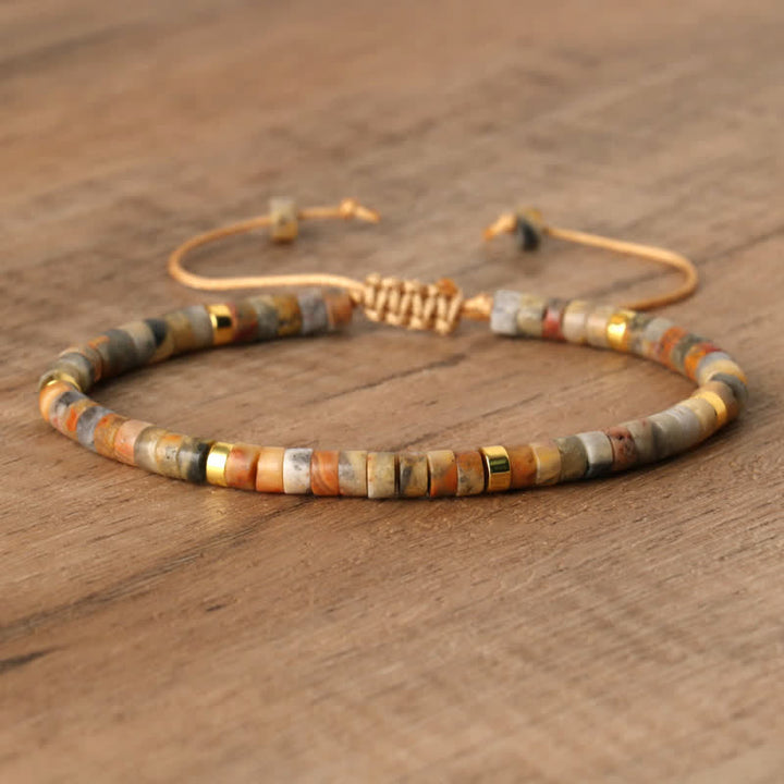 Handmade Seraphina women's braided bracelet with natural stone rollers. A unique piece.