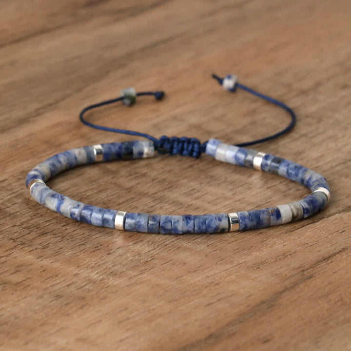 Spiritual Seraphina women's bracelet: braided band & natural stone rollers.