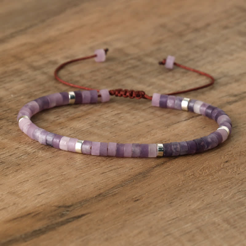 Elegant Seraphina women's braided bracelet, natural stone rollers. Sophisticated appeal.