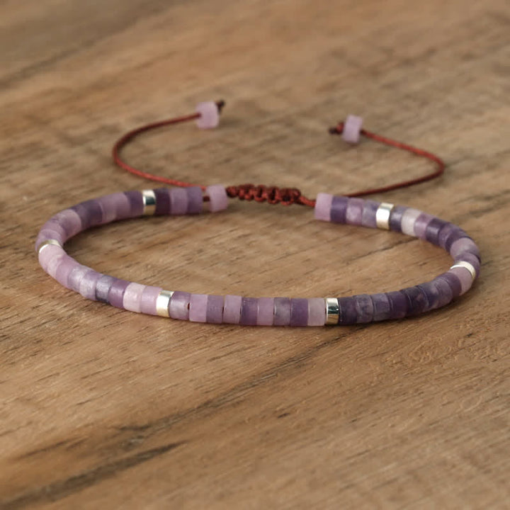 Elegant Seraphina women's braided bracelet, natural stone rollers. Sophisticated appeal.