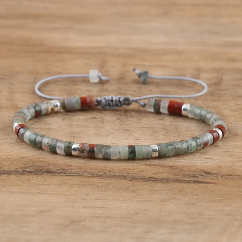 Women's Seraphina bracelet: handmade, braided, natural gemstone rollers, adjustable fit.