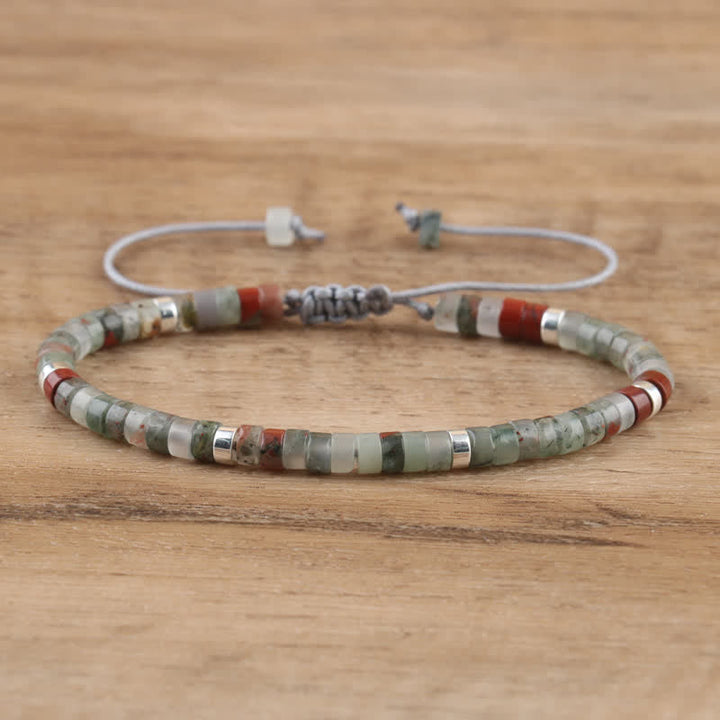 Women's Seraphina bracelet: handmade, braided, natural gemstone rollers, adjustable fit.