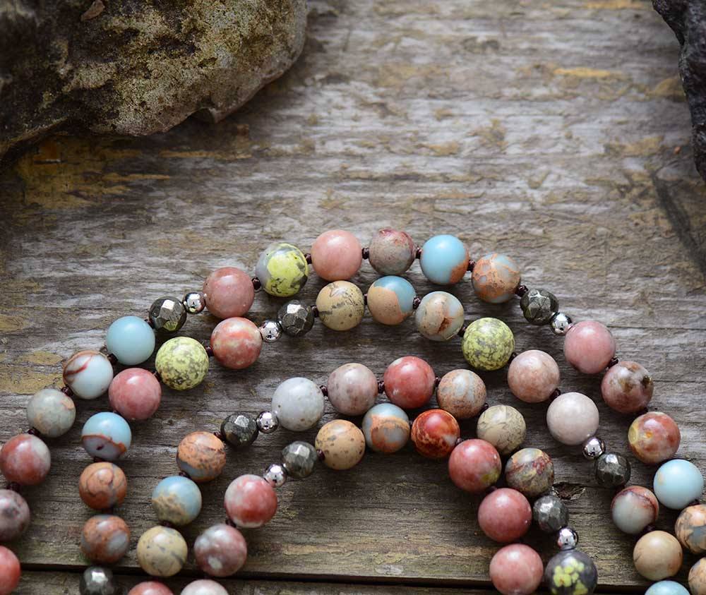 Seraphina women's mala necklace: rhodonite & hematite beads promote heart strength, healing, and meditation.