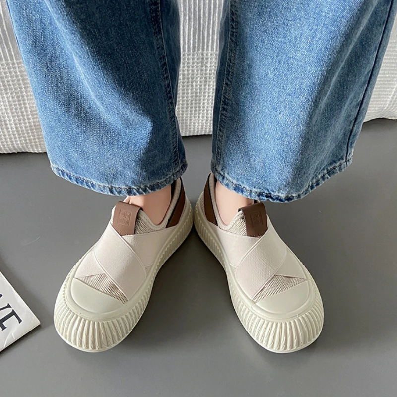 Everyday white Seraphine platform sneakers, offering slip-on convenience and modern look.
