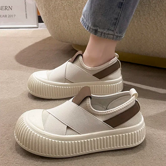 Side view of black Seraphine platform loafer sneakers, showing comfort design & modern sole.