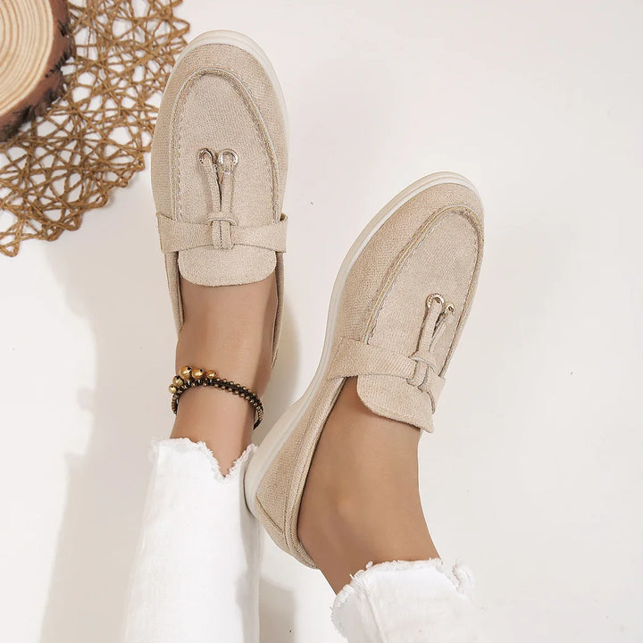 Woman enjoying comfortable everyday wear in versatile Serena slip-on loafers. Modern casual shoes.
