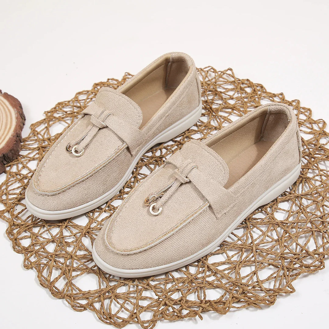 Side profile of Serena women's slip-on loafers, showcasing sleek modern design & cushioned sole for comfort.