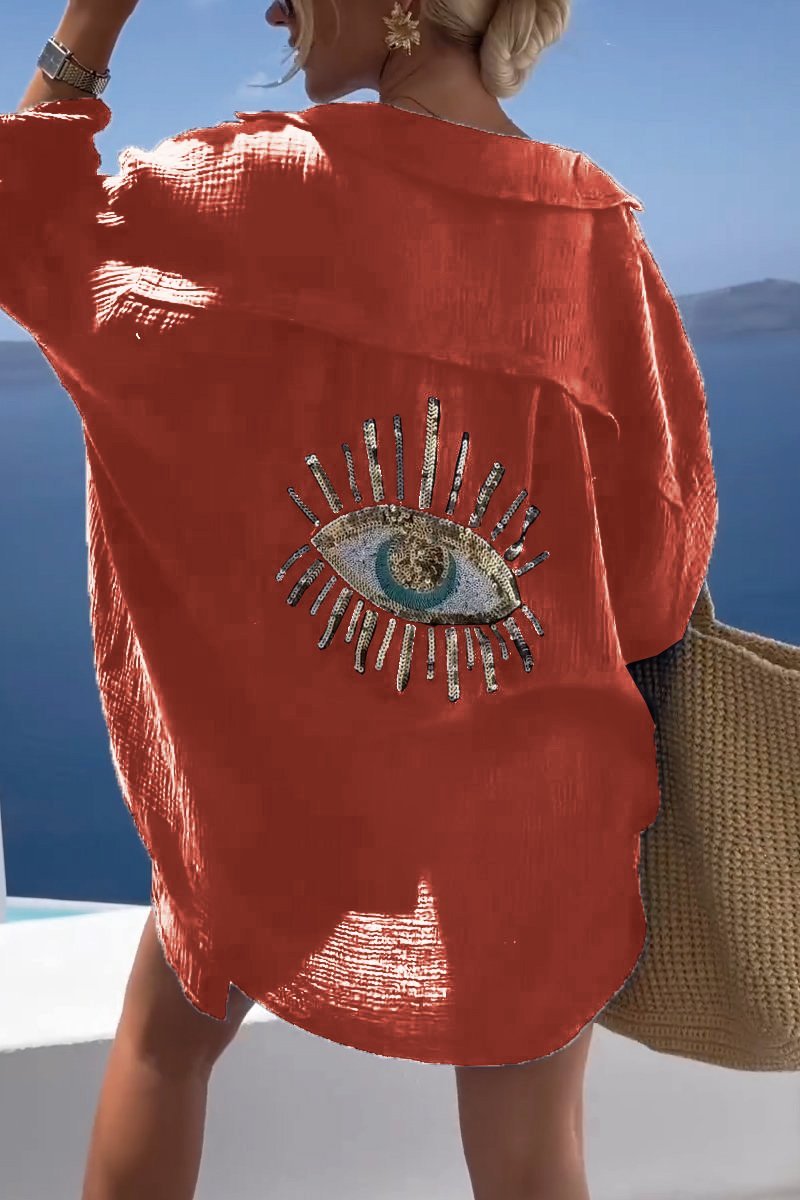 Chic Serena women's summer tunic, versatile for casual or elegant looks, with unique embellished back.