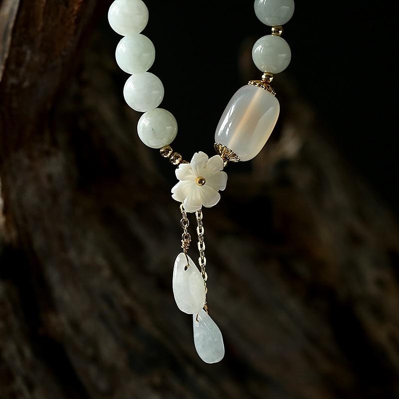 Green jade and white agate beaded bracelet for women, promoting serenity and style, with crystal energies