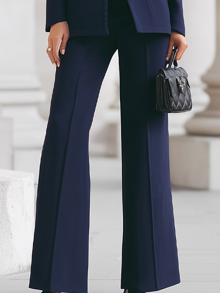 Modern women's Sharie suit set with a tailored blazer and matching trousers, perfect for a chic look.