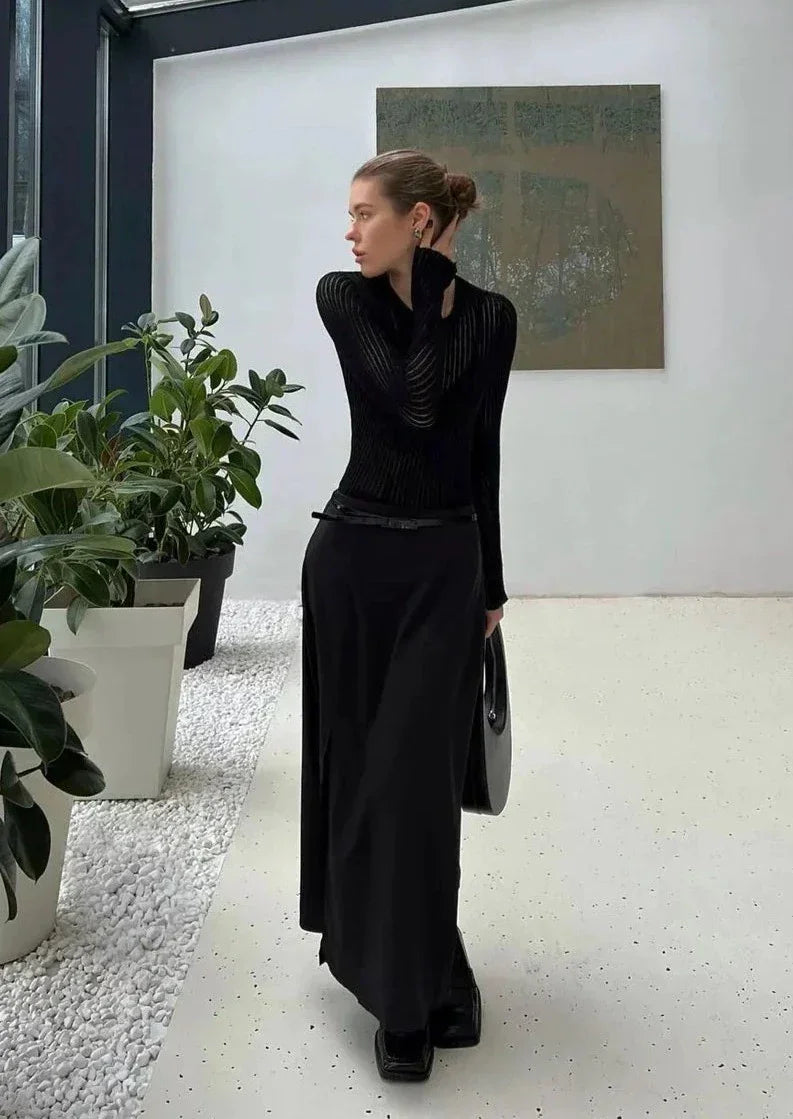 Modern women's sheer ribbed long sleeve top. Fitted design, elegant, versatile for fashion-forward styling.