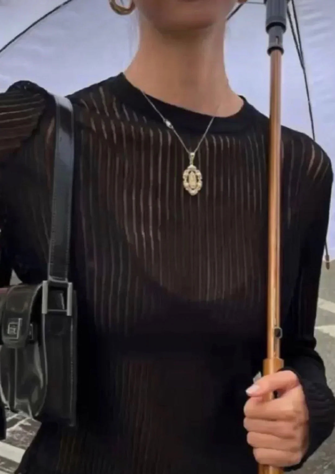 Women's fitted sheer ribbed long sleeve top. Chic, comfortable, versatile. A wardrobe essential for any style.