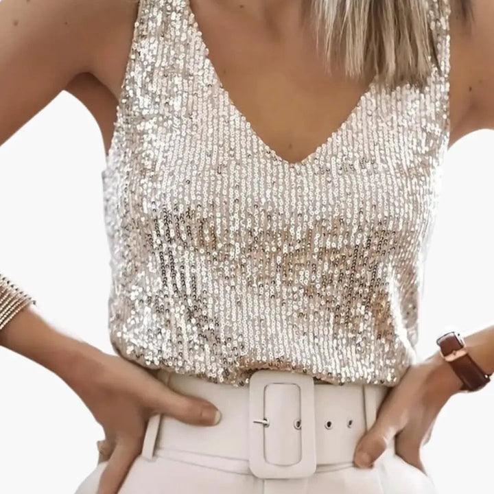 Elegant women's sleeveless sequin top. Round neck, shimmery design, ideal for evening or casual elegant wear.