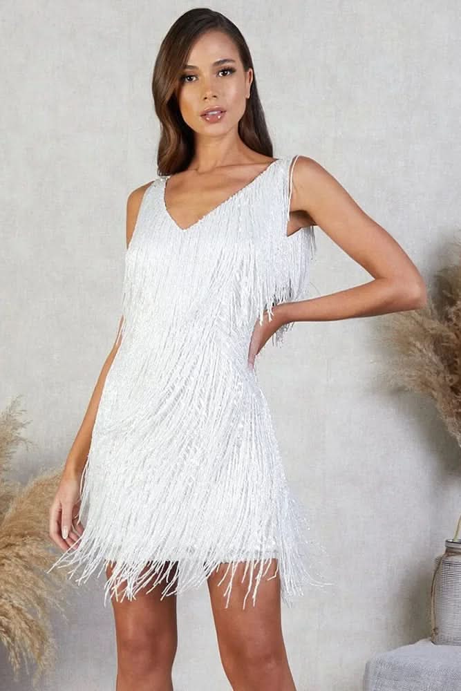 Chic women's cocktail A-line dress with shimmering sequins and dynamic fringe. Ideal for evening glamour.