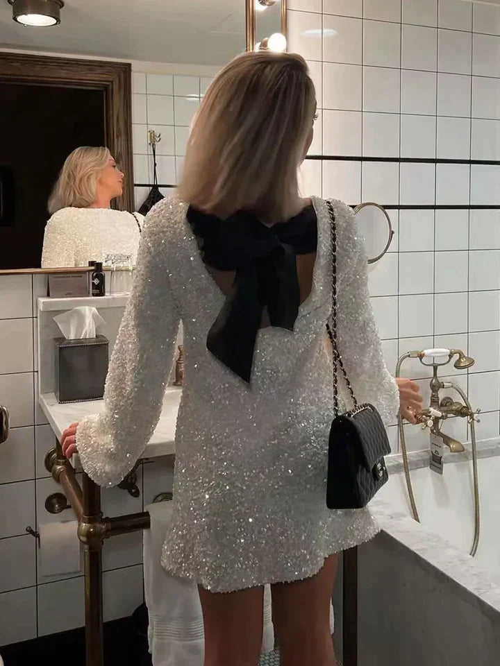 Women's shimmering glitter midi dress, perfect for special occasions & evening parties. Elegant festive wear.